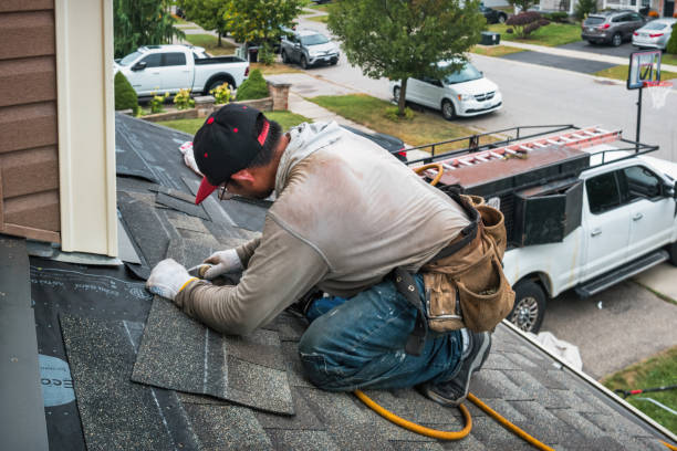 Professional Roof Replacement technician working in Little Falls, NY